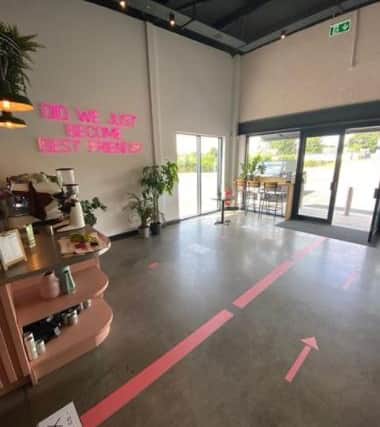 New social distancing measures inside the coffee shop include a one-way system and a max of two customers.