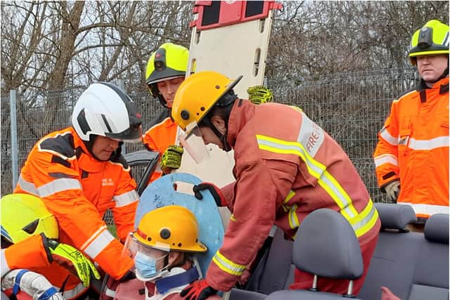 Young people take part in a mock fire crew exercise.