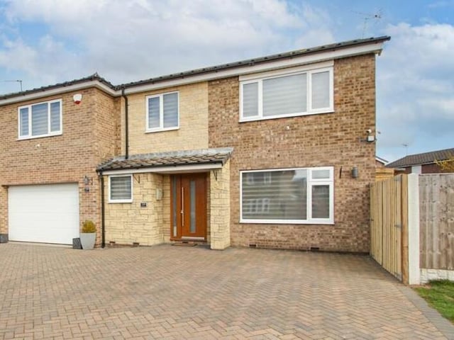 The approach to the front of the six-bedroom property.