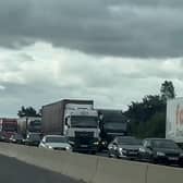 A still image from a video showing the 'go slow' fuel protest by lorries on the M180 near Doncaster. Credit BBC Radio Humberside.