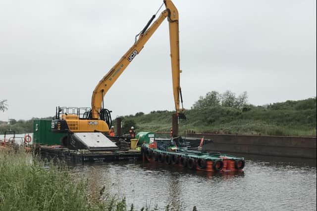 40 tonne excavator being moved to slip location at Wheatley Park, Doncaster