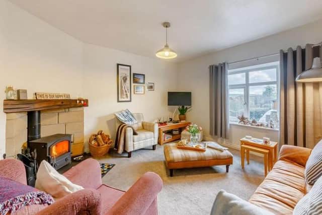 The lounge contains a traditional log burner.