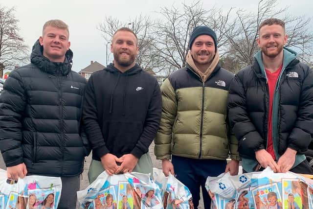 Doncaster Knights donate toys to DRI.