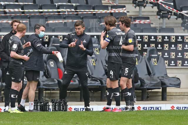 Andy Butler gives instructions to his players during the defeat at MK Dons. Picture: Gareth Williams/AHPIX