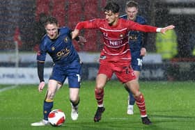 Lirak Hasani battles with Mansfield's Stephen Quinn during Saturday's FA Cup defeat. Picture: Andrew Roe/AHPIX LTD