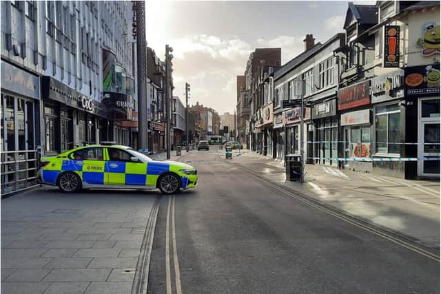 Police guard the scene in Silver Street.
