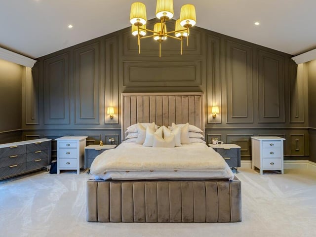 The principal bedroom has a walk-in wardrobe and a lavish en suite facility.