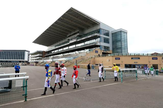 Jockeys make their way out from the weighing room at Doncaster Racecourse. Photo: Mike Egerton - Pool/Getty Images