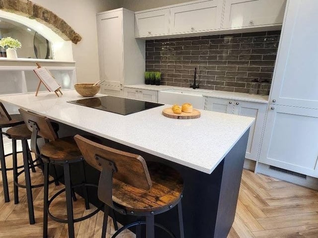 A sleek and spacious kitchen and dining area.