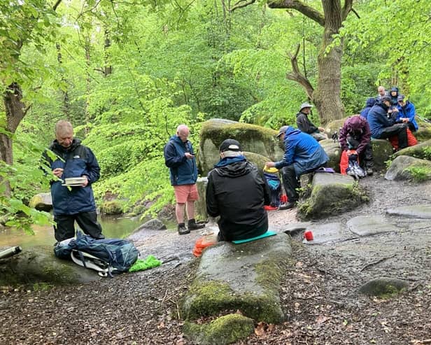 The group enjoyed elevenses on boulders next to a tributary of the Derwent