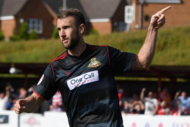 Andy Williams celebrates his equaliser for Rovers at Accrington