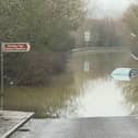 Car left stranded as Doncaster road is completely flooded following snow and rainfall.