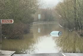 Car left stranded as Doncaster road is completely flooded following snow and rainfall.