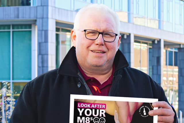Councillor Ball with a campaign poster