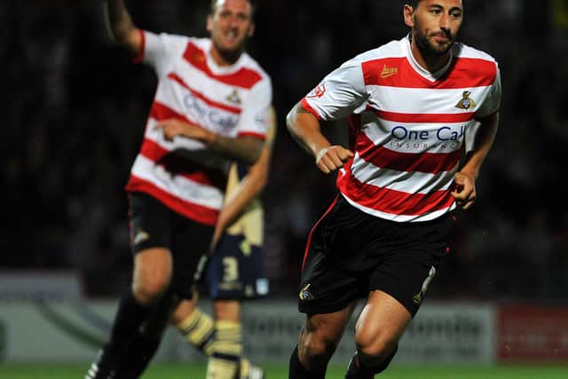 Doncaster's Billy Paynter celebrates scoring against Leeds United with Chris Brown.