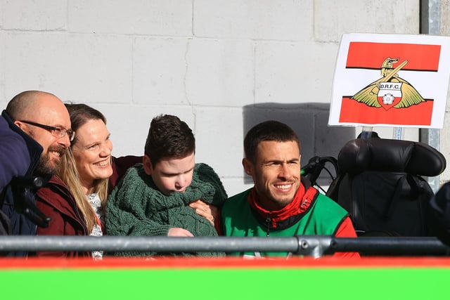 Doncaster Rovers' Tommy Rowe poses for a picture with fans.