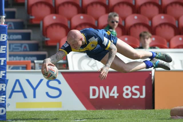 Tom Halliday dives over to score for Doncaster. Photo: AHPIX LTD