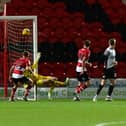 Doncaster's keeper Louis Jones is beaten by Morecambe's Michael Mellon for his sides fifth goal. (Picture:Andrew Roe/AHPIX LTD)
