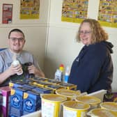 Service user, Robert Sharpe with Barbara Malone who is a work coach at Aspire to Be in the new retail shop area