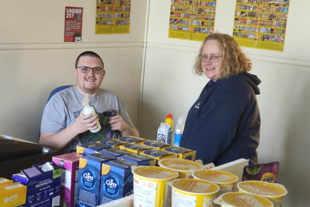 Service user, Robert Sharpe with Barbara Malone who is a work coach at Aspire to Be in the new retail shop area