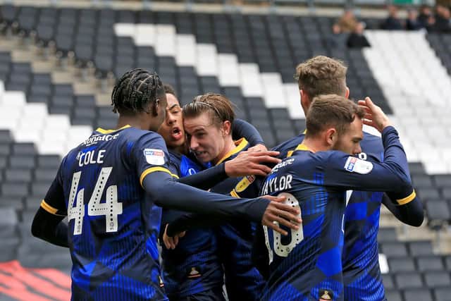 Rovers celebrate Jacob Ramsey's goal at MK Dons