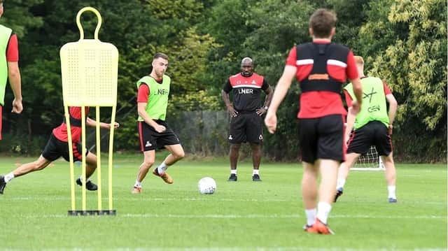 Darren Moore oversees first team training