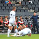 Doncaster Rovers manager Grant McCann appeals a decision from referee Andrew Kitchen.