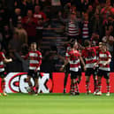 Joe Ironside of Doncaster Rovers celebrates with his teammates after scoring the team's first goal  during the Carabao Cup Second Round match between Doncaster Rovers and Everton at Keepmoat Stadium on August 30, 2023 in Doncaster, England. (Photo by George Wood/Getty Images)