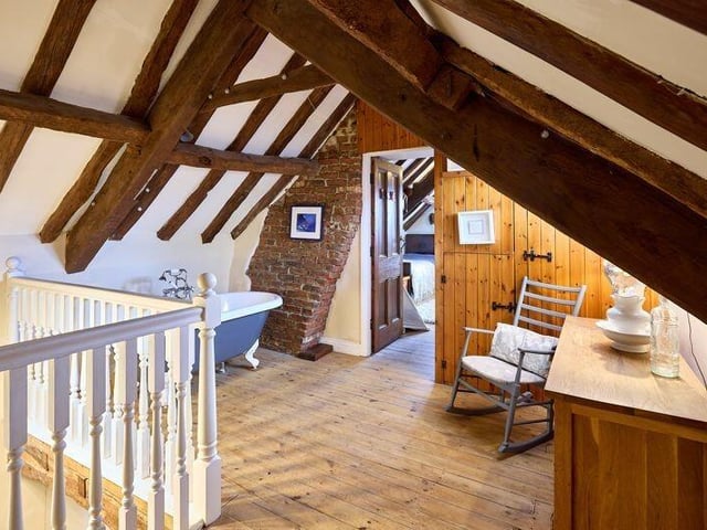 An upper floor suite, with free standing bath.
