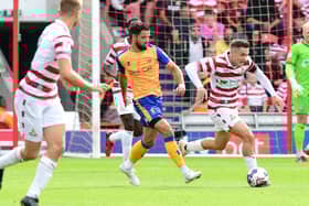 Luke Molyneux gets away from Mansfield's Stephen McLaughlin. Picture: Andrew Roe/AHPIX LTD
