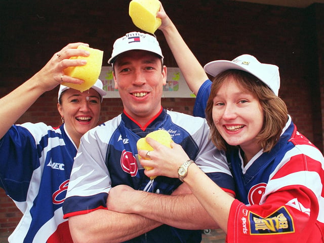 Sheffield Eagles' Mark Aston was given a soaking by Midland Bank girls, l to r: Wendy Ramsay, (left) and Rachael Ball, at Morrisons at Halfway in 1998