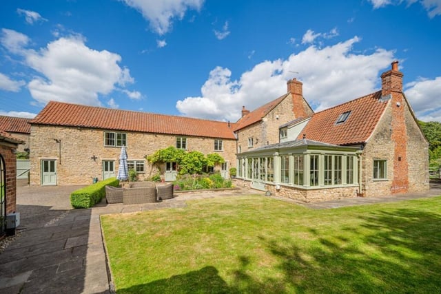 Another aspect of the home, with a seating area and part of the south facing garden.