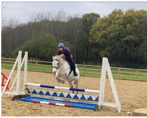Alyssia at an arena eventing clinic with her pony, Mara.