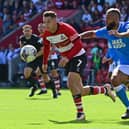 Luke Molyneux and John Bostock chase after the loose ball. Picture: Andrew Roe/AHPIX LTD