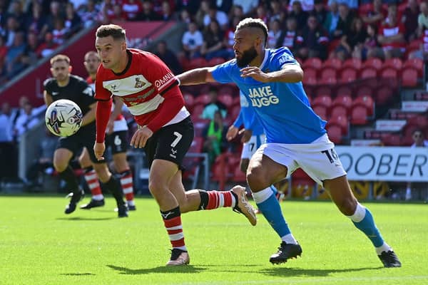 Luke Molyneux and John Bostock chase after the loose ball. Picture: Andrew Roe/AHPIX LTD