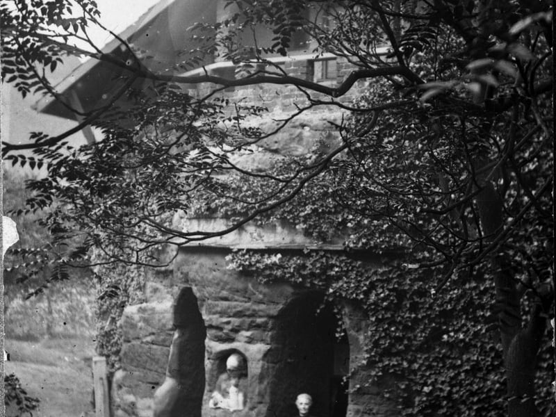 The gable end of the Sand House. The natural sandstone from which the house was carved is visible.