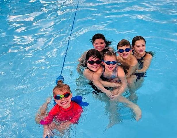 The group of swimmers raised money for two different charities.