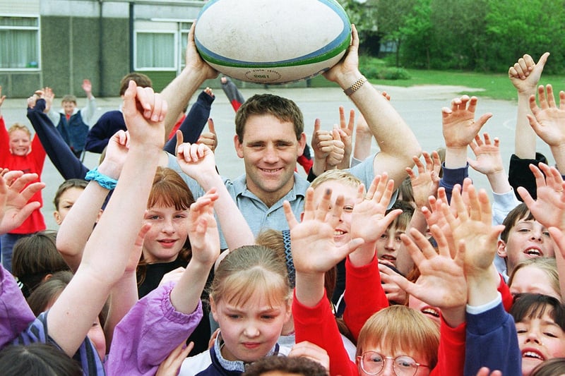 Former Rugby Union international Richard Wareham with Armthorpe Tranmoor Primary School pupils in April 1997