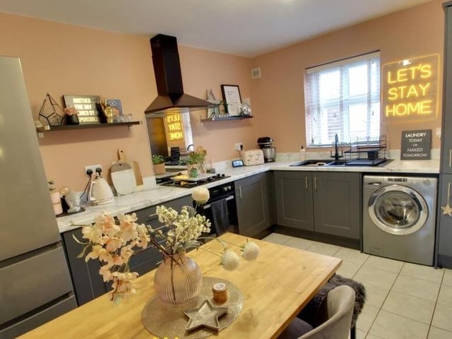 The dining kitchen is fitted with Shaker-style units.