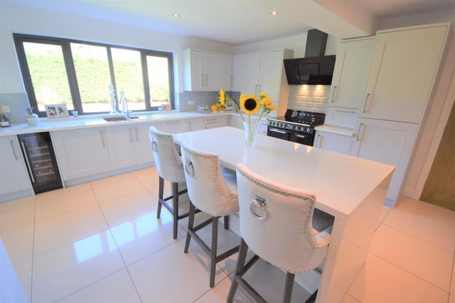 The kitchen is newly refurbished, and boasts dove grey shaker style walls and base units with contrasting work surfaces. Appliances included a built in fridge and freezer, built in dishwasher, wine cooler, Smeg oven with induction hob and more.