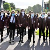 18-08-2021. Picture Michael Gillen. FALKIRK. One year and 147 days of UK wide coronavirus restriction measures. Day 10 of almost no restrictions. Scotland is now below Level zero, Level 0. FALKIRK. Westburn Avenue. Falkirk High School first year pupils it's their first day in S1. Group of friends walking to school.