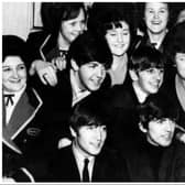 The Beatles surrounded by female admirers on one of their five visits to Doncaster.
