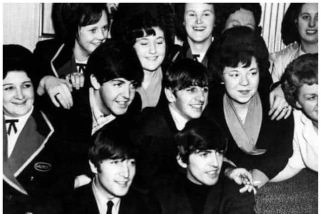 The Beatles surrounded by female admirers on one of their five visits to Doncaster.