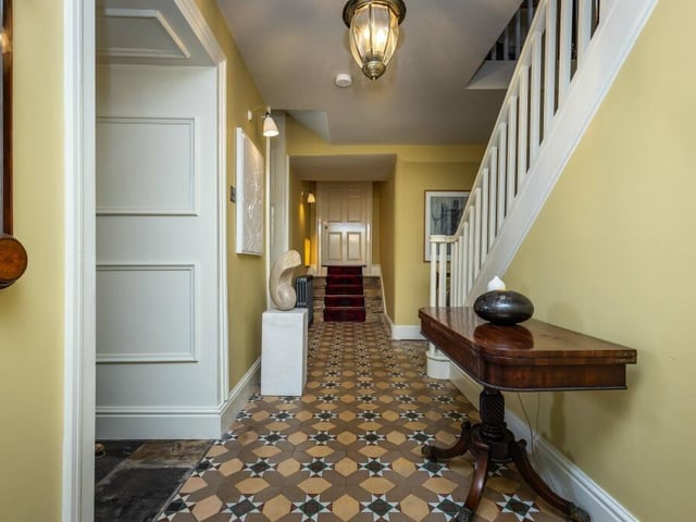 The main hallway, with staircase up to the first floor.