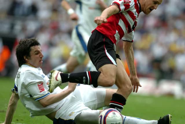 James Coppinger looks to skip past Jonathan Douglas