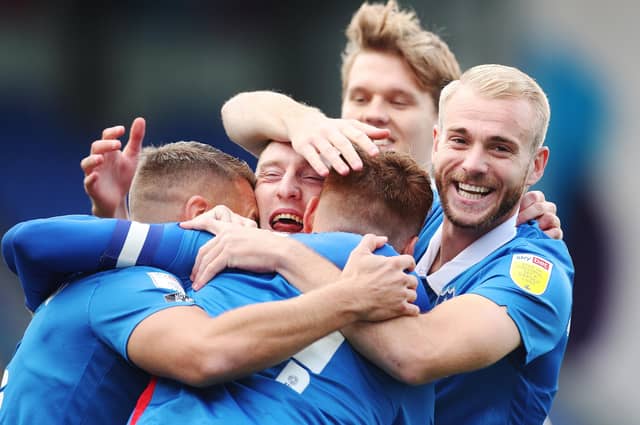 League Division 1 - Portsmouth vs MK Dons - 10/10/2020
Portsmouth's Tom Naylor celebrates scoring his first goal of the match with Portsmouth's Lee Brown Portsmouth's Ronan Curtis Portsmouth's Jack Whatmough