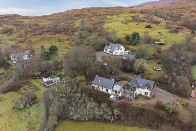 Bluebell Croft with holiday cottages in front and main house behind.