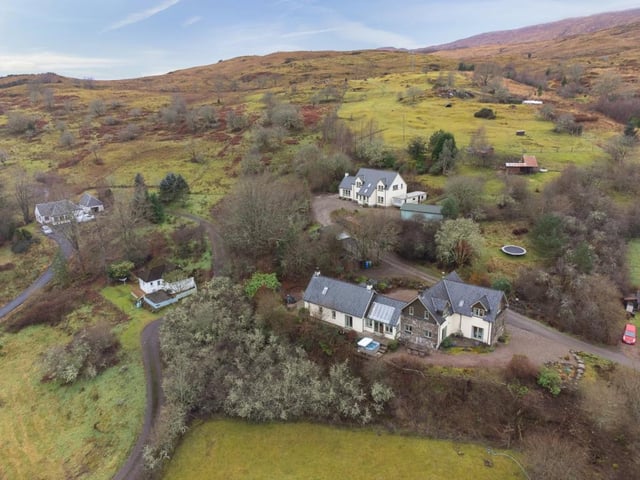 Bluebell Croft with holiday cottages in front and main house behind.