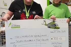 Kristian handing over his initial fundraising to the Children’s Air Ambulance
