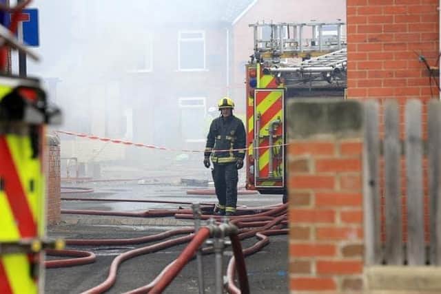 A man has been arrested following arson attacks on a business premises in Doncaster which caused over £13,000 worth of damage.